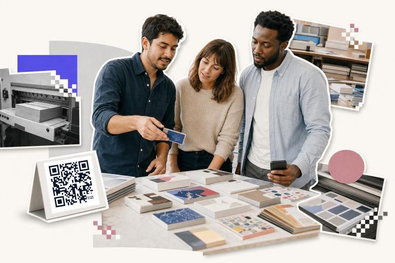 Three people examine print samples on a table with a QR code card showing how to add QR code to business card.