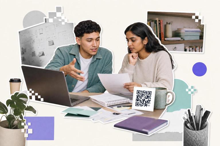Two people discuss a document at a desk with a QR code card and laptop, exploring if Claude can generate QR codes.