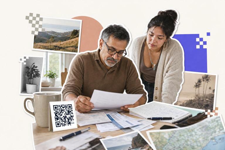 Two people reviewing documents at a table with a QR code card and travel photos, can you screenshot a QR code.