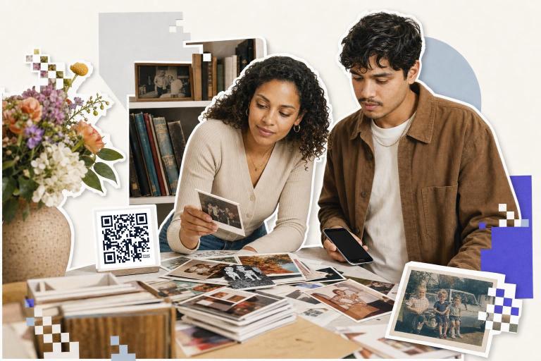 Two people look at old photos on a table with a QR code card nearby for scanning., scan qr code from picture