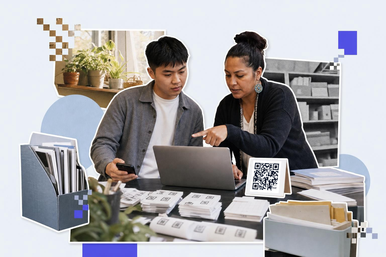 Two people discuss at a laptop with QR code cards on the table in an office setting.