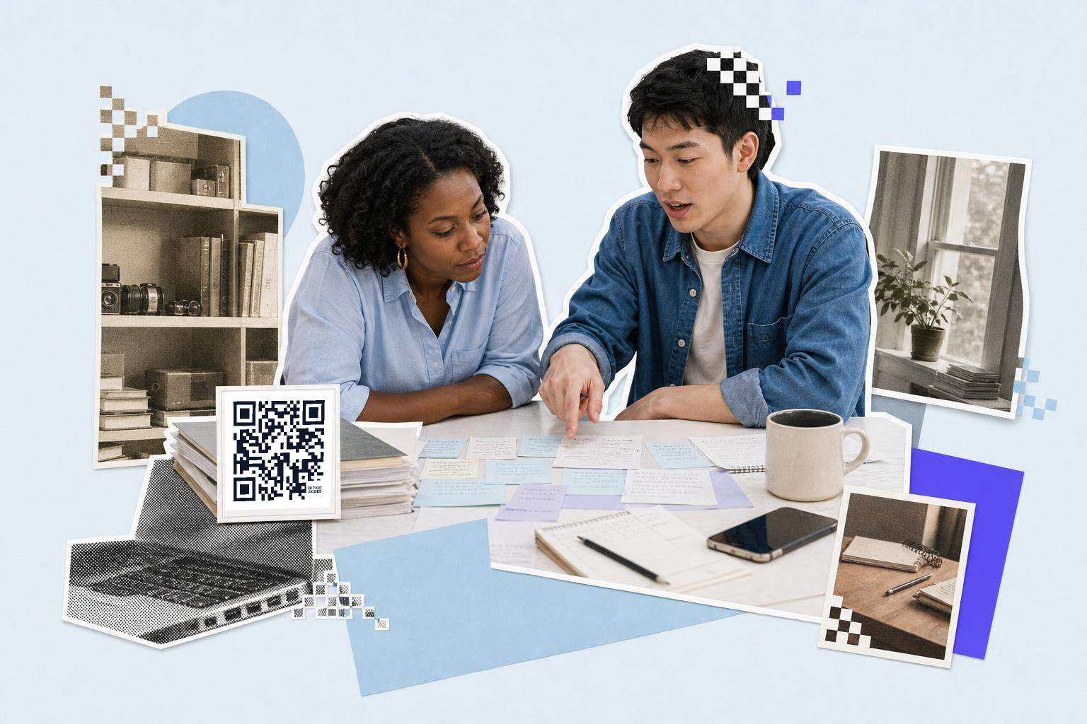 Two people discussing notes at a table with a QR code on a stack of books.