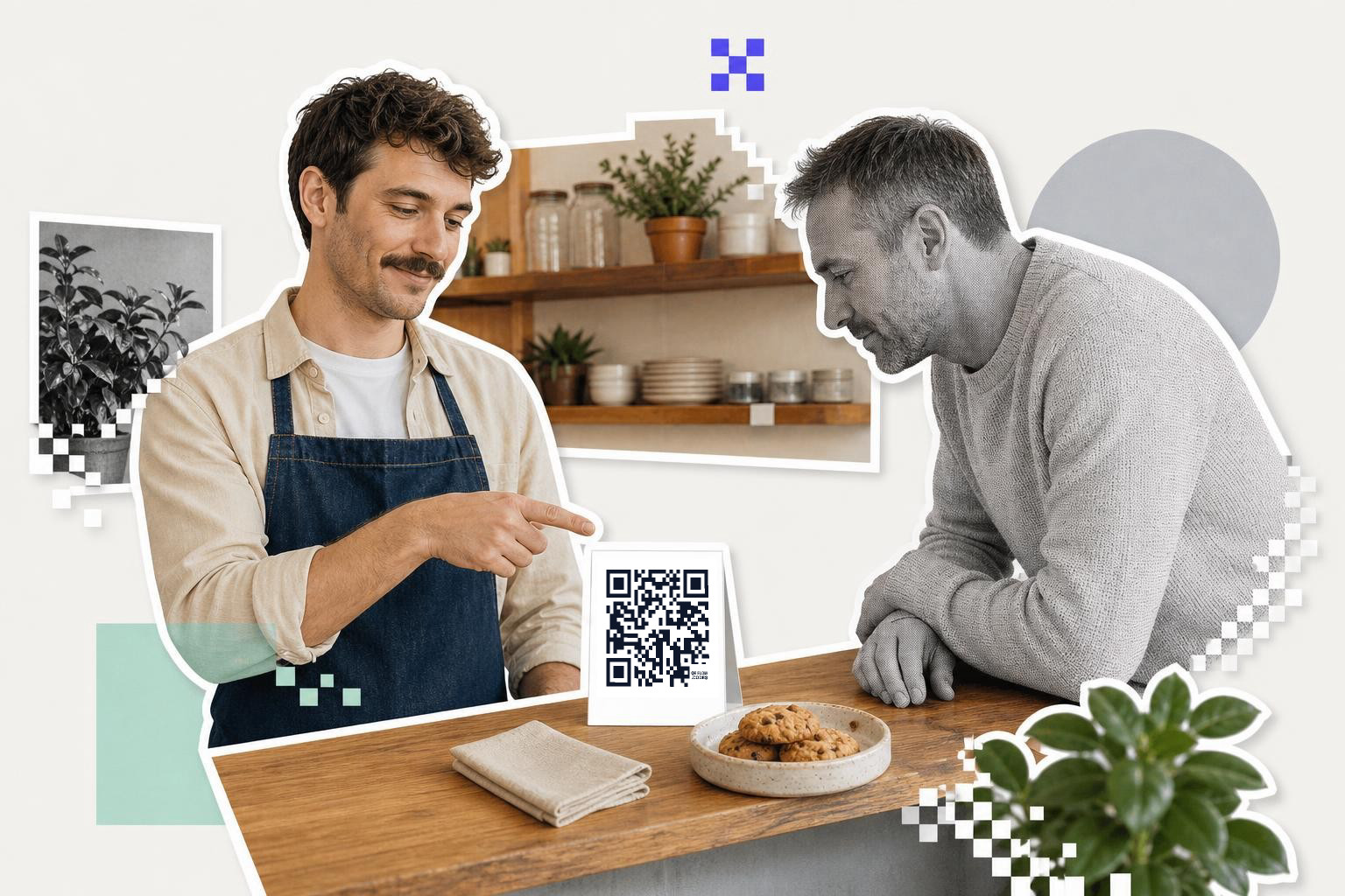 Two men at a counter with cookies and a QR code card, one pointing at the card.