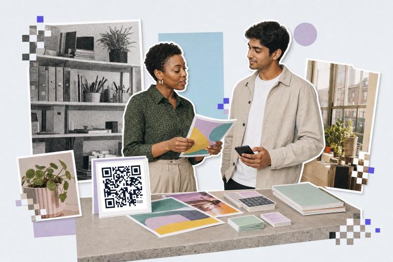 Two people discuss colorful papers at a table with a QR code card labeled for flow codes.
