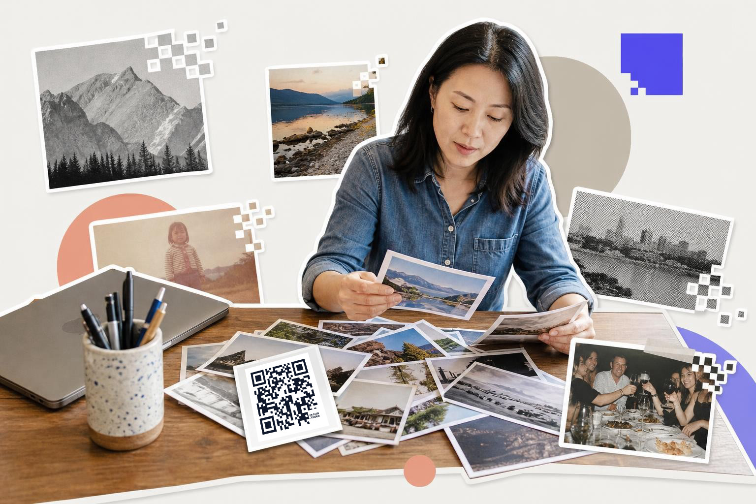 Woman in denim shirt examines photographs at a table with a QR code card and laptop nearby.