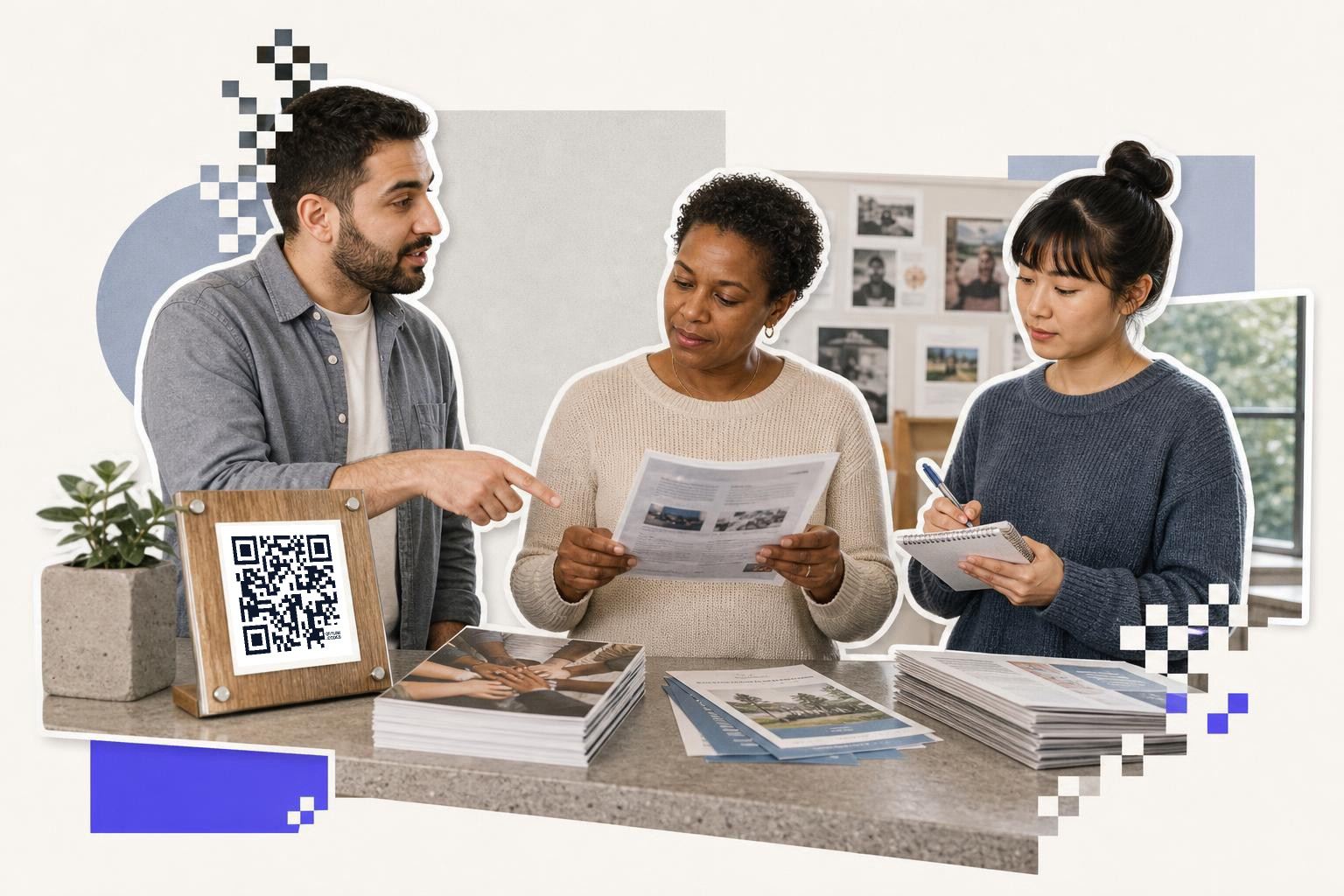 Three people discussing documents at a table with a QR code sign and brochures.